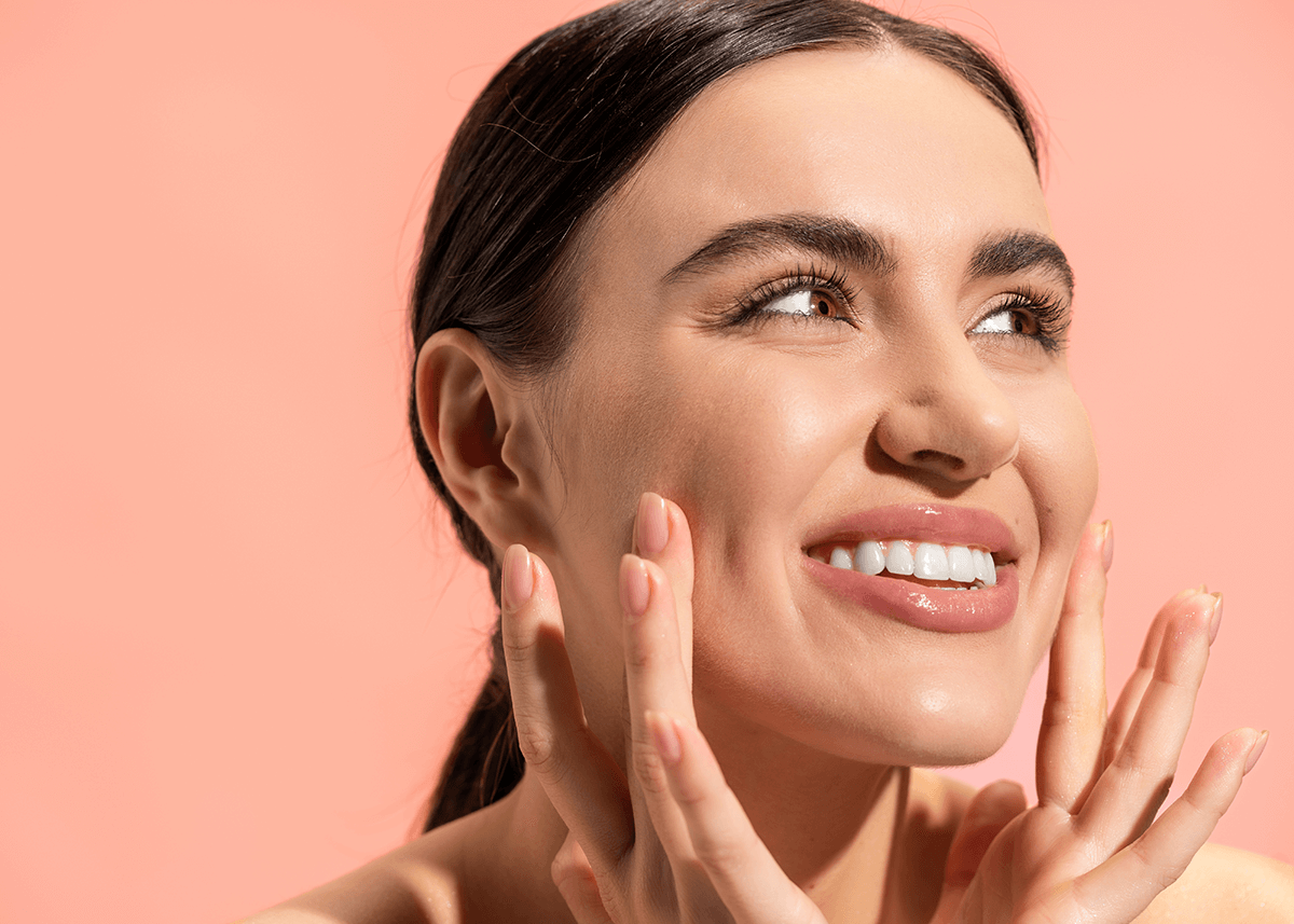 Cheerful Young Woman Touching Cheeks and Looking Happy