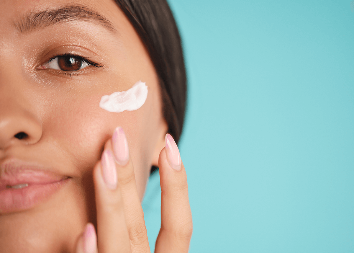 Closeup of Asian Girl applying Primer to Skin