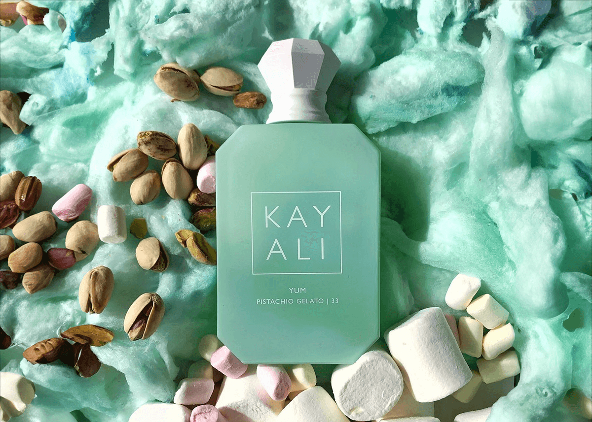 Kayali pistachio on bed of cotton candy and marshmallows