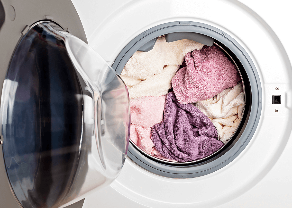 laundry machine with towels inside