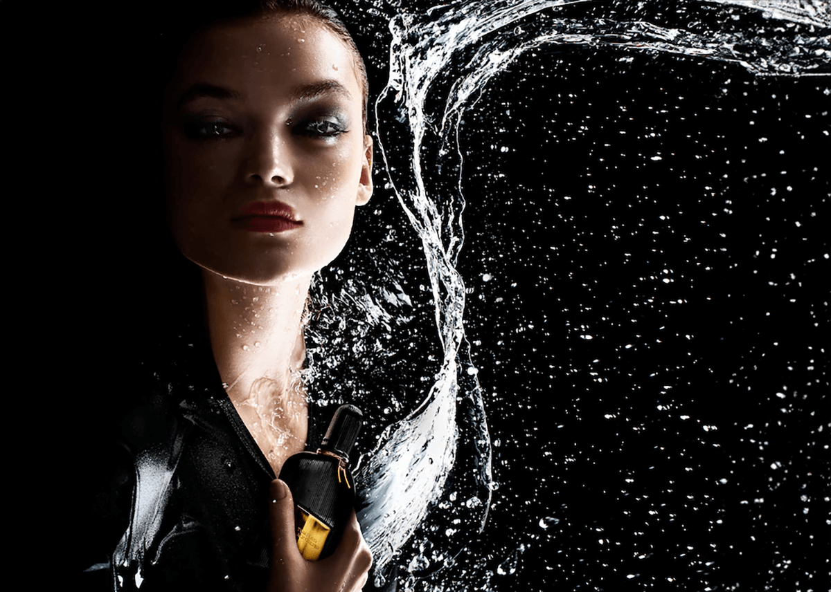 tom ford black orchid model posing water splash