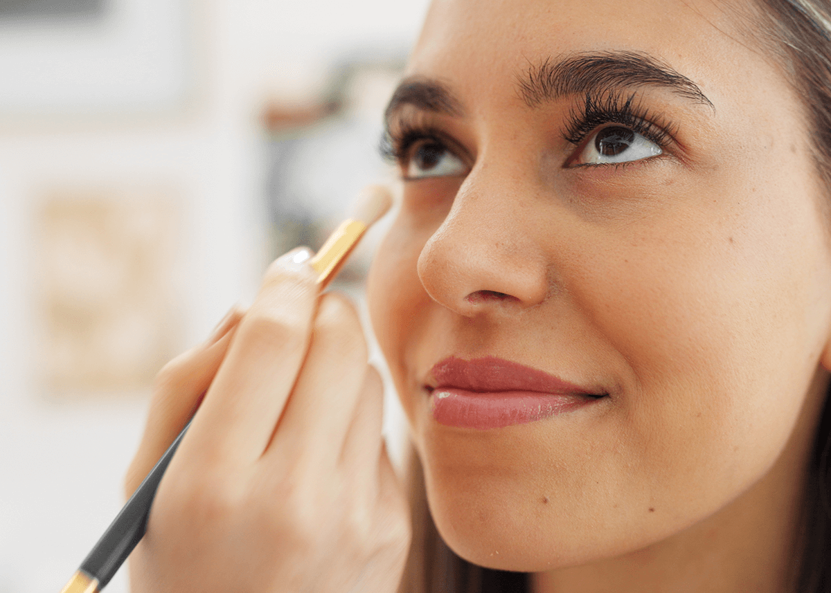 Girl applying Natural Eye Makeup