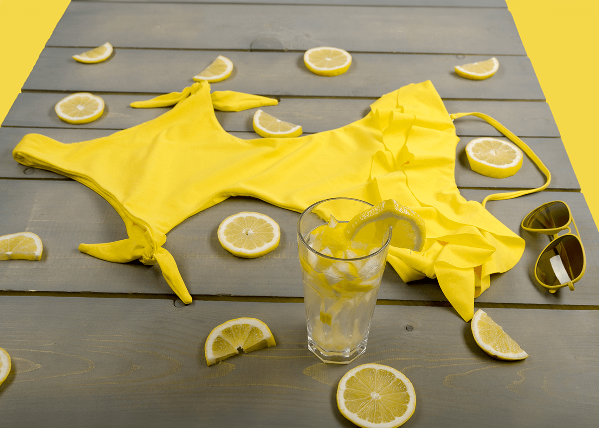 yellow bathing suit with lemons around